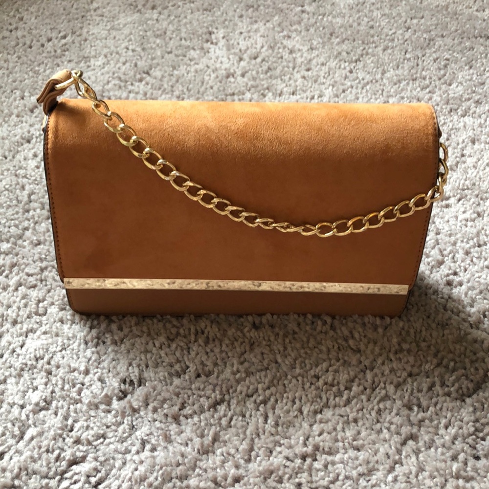 Tan crossbody with gold details.